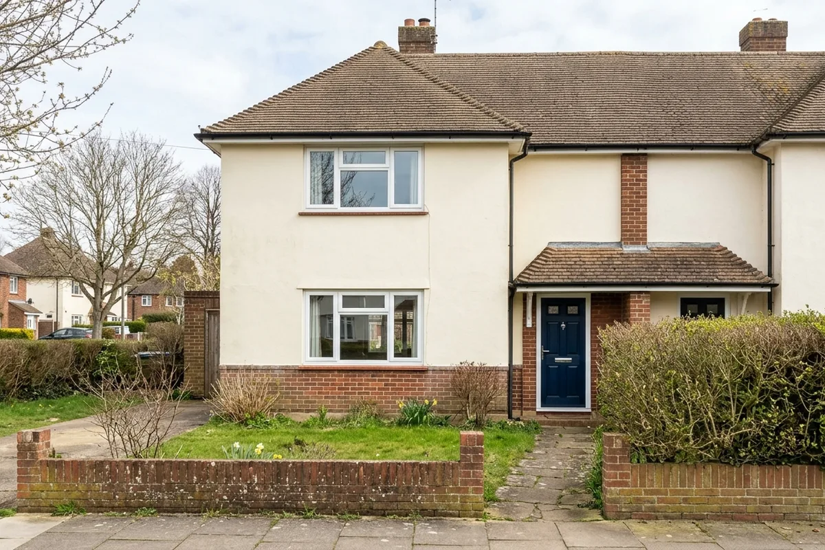 White chamfered uPVC casement windows on a 1950s rendered semi in Horsham